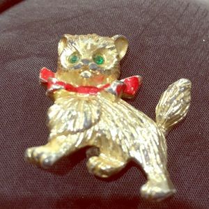 Gold cat brooch with green sparkling eyes. 1.5 in